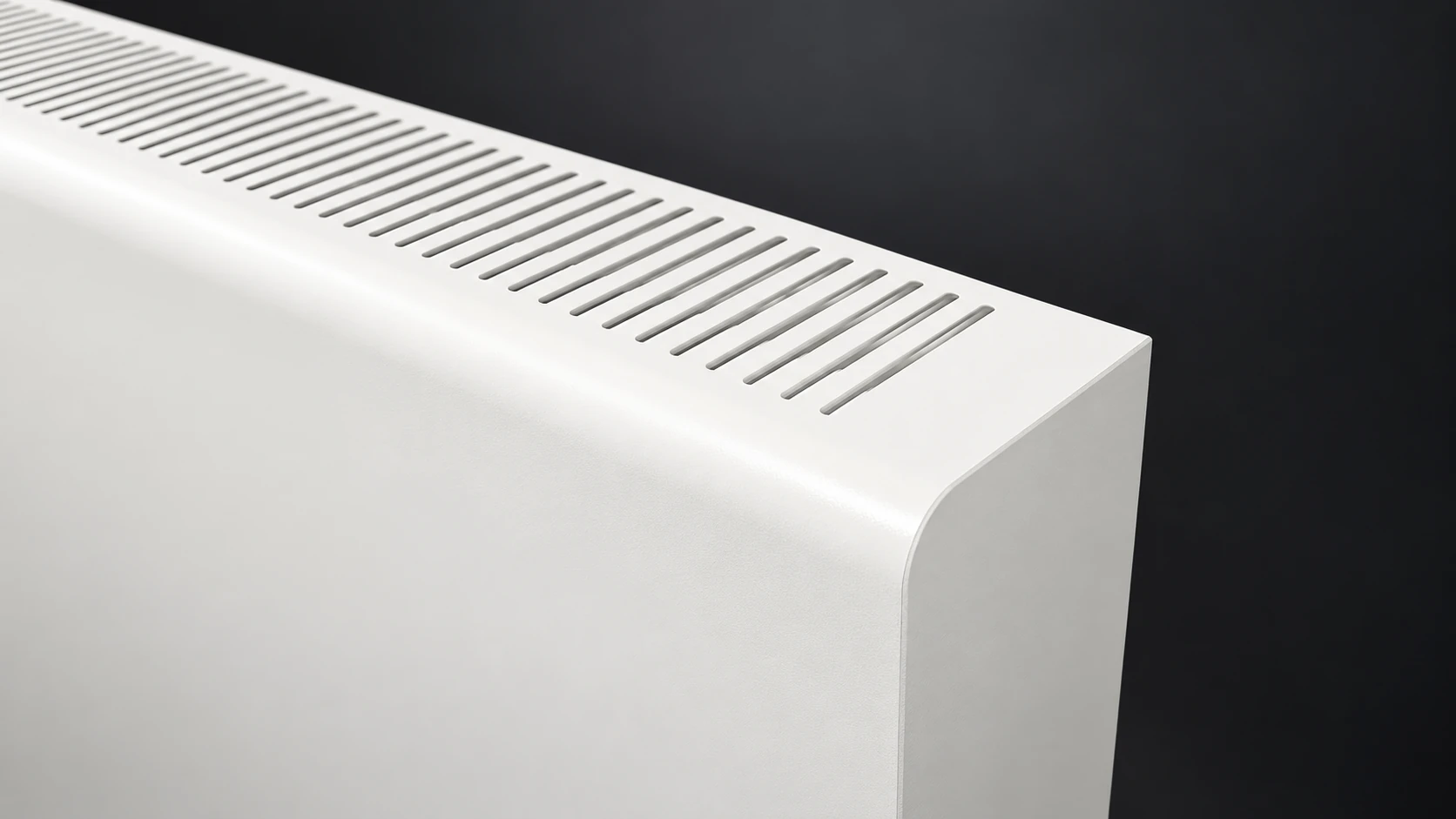 Close-up render of a RAL 9010 Coverad steel radiator cover with curved corner and top ventilation slots